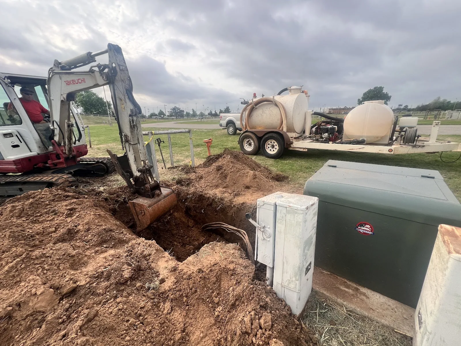Excavator at a bore pit during a natural gas line boring job