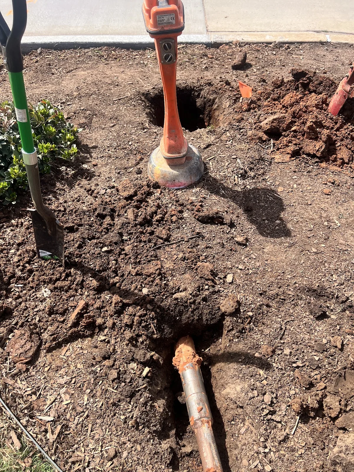 Pipe Junction Excavation Dallas HDD Contractors Completed bore pit with utility conduit ready for backfill