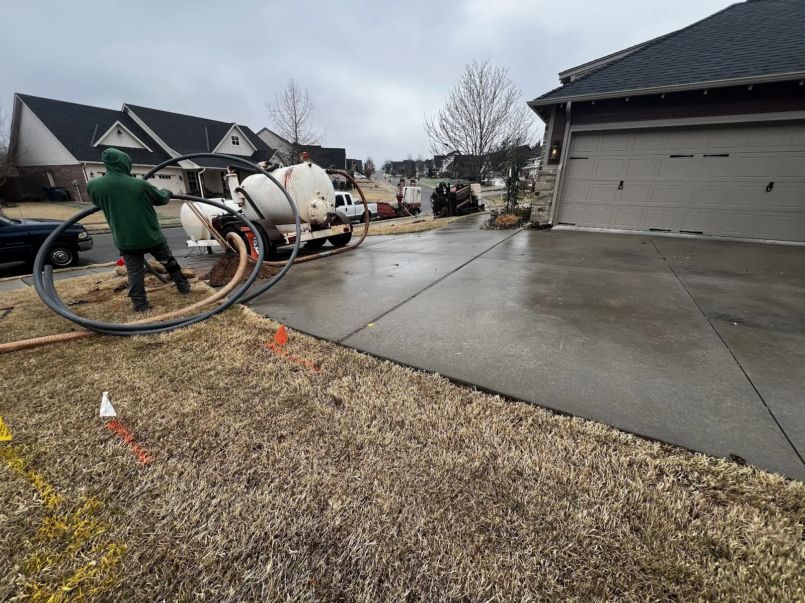 Potholing and daylighting an exposed utility line in a bore pit before a sewer bore