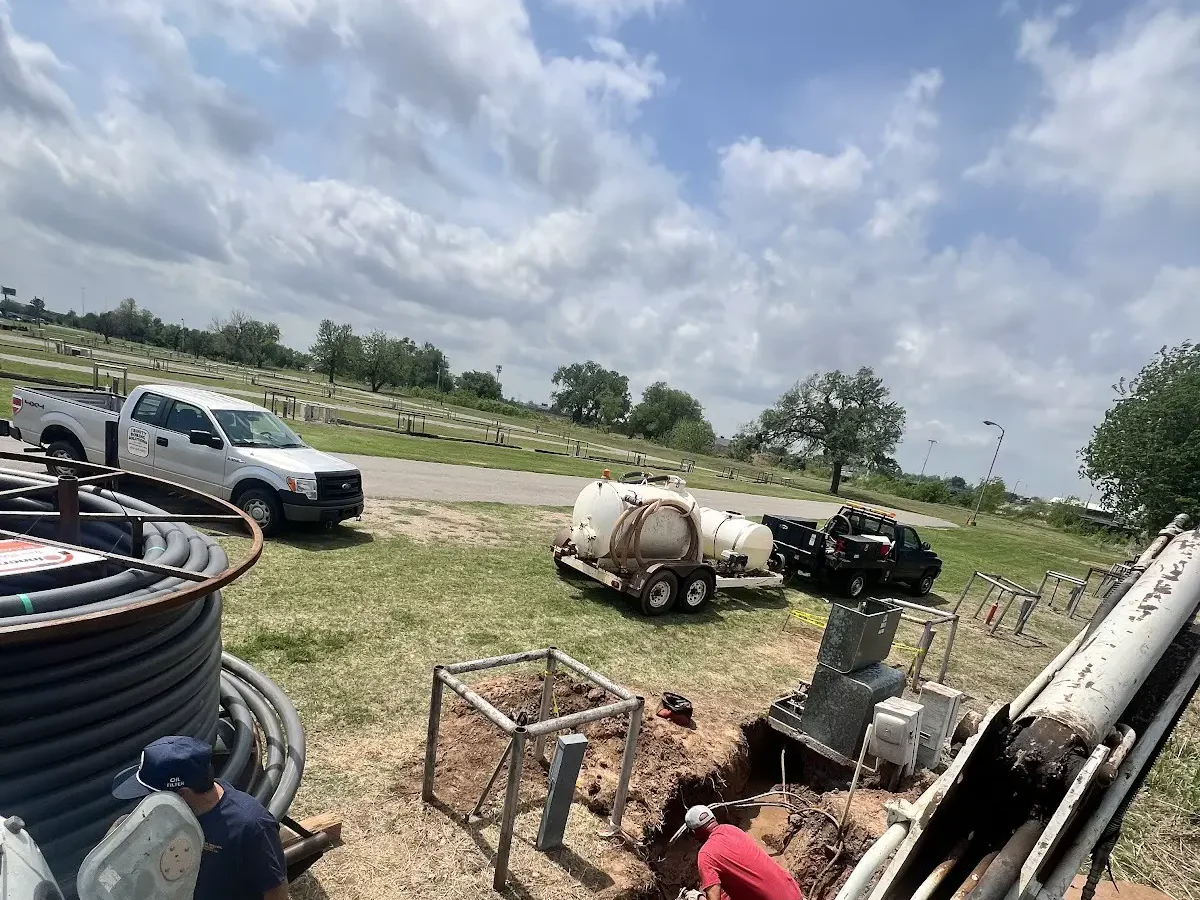 Workers Excavation Pit Dallas HDD Contractors Crew fusing HDPE pipe sections before a long-distance bore
