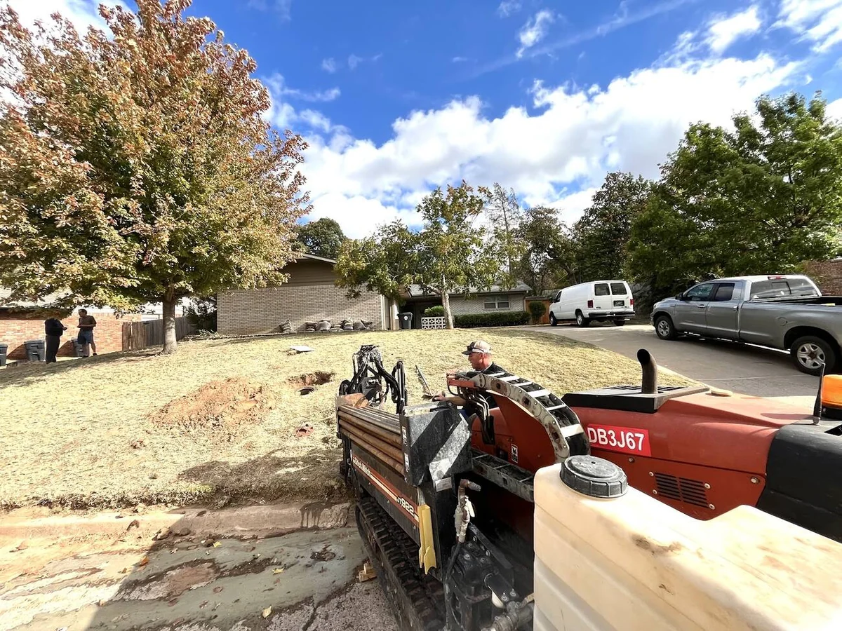 Residential Neighborhood Bore Dallas HDD Contractors Bore pit with drill string entering the ground on a utility job